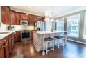 Beautiful kitchen with an island, hardwood floors, stainless steel appliances, and natural light at 4621 Wehunt Commons Se Dr # 7, Smyrna, GA 30082