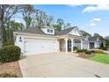 Attractive single-story home featuring a spacious driveway, well-kept lawn, and a charming front porch at 161 Grace Cir, Acworth, GA 30102