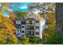 Rear exterior view of a home featuring three stories and private balconies at 220 Alcovy Terrace, Alpharetta, GA 30009