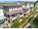 Aerial view of elegant townhomes featuring covered porches, stone accents, and manicured landscaping at 914 Martin Nw St, Atlanta, GA 30318