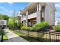 Elegant townhomes featuring covered porches and beautiful landscaping at 914 Martin Nw St, Atlanta, GA 30318