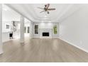 Bright and airy living room featuring a fireplace and seamless flow to the kitchen for modern living at 2025 Golden Ridge Cir, Cumming, GA 30040