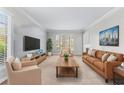 Spacious living room with neutral decor, large windows, and comfortable seating at 2350 Powers Ferry Se Dr, Marietta, GA 30067
