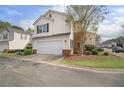 View of home featuring attached two-car garage and neutral siding at 612 Windcroft Nw Cir, Acworth, GA 30101