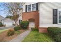 Charming two-story townhome with landscaped front yard and neutral siding at 612 Windcroft Nw Cir, Acworth, GA 30101