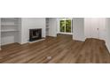 Living room with wood floors, built in shelves and a fireplace at 1017 Dunbar Dr, Atlanta, GA 30338