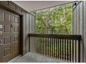 Balcony featuring the unit's door with a view of the woods at 1017 Dunbar Dr, Atlanta, GA 30338