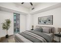 Neutral toned bedroom featuring a large window with natural light at 1100 Howell Mill Nw Rd # 408, Atlanta, GA 30318
