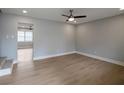 Open living room with hardwood floors, light gray walls, and recessed lights at 1449 Hoy Taylor Dr, Norcross, GA 30093