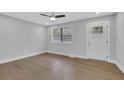 Bright living room with a ceiling fan, recessed lights, and hardwood floors at 1449 Hoy Taylor Dr, Norcross, GA 30093