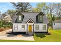 Quaint home showcasing unique architectural features and vibrant landscaping at 1071 N Price Rd, Sugar Hill, GA 30518