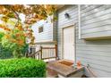 Side entry showcasing the exterior door, siding, and surrounding greenery of the house at 1486 Harbins Rd, Norcross, GA 30093