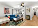 Inviting living room with stylish decor, hardwood floors, and a ceiling fan at 1027 Garibaldi Sw St, Atlanta, GA 30310
