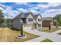 Beautiful exterior of a two-story home with a manicured lawn and attached garage near the lake at 1861 Poplar Falls Ave, Lithonia, GA 30058