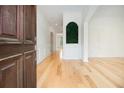 Bright entryway boasting hardwood floors, white walls, and decorative molding, creating a welcoming atmosphere at 4355 Rainer Dr, Atlanta, GA 30349