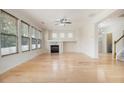 Spacious living room with hardwood floors, a fireplace, and large windows offering ample natural light at 4355 Rainer Dr, Atlanta, GA 30349