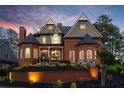 Stunning brick home with manicured landscaping and beautiful architectural details at 145 Cuthbert Ln, Acworth, GA 30101