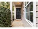 Inviting front entrance with a classic black door and a welcoming mat at 261 Silver Ridge Dr, Dallas, GA 30157