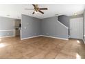 Open concept living room with tile flooring and a modern ceiling fan at 261 Silver Ridge Dr, Dallas, GA 30157