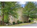 Side view of a traditional two-story house with lots of trees, blending into the surrounding neighborhood at 325 Valley Brook Way, Atlanta, GA 30342