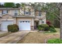 Inviting townhome with well-maintained landscaping and a private driveway at 537 Rendezvous Rd, Acworth, GA 30102