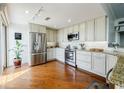 Well-equipped kitchen with stainless steel appliances, granite countertops, and ample cabinet space at 195 14Th Ne St # Ph206, Atlanta, GA 30309
