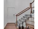 Staircase with neutral gray carpet runner, wooden handrail, and white risers at 1674 Executive Park Ne Ln, Atlanta, GA 30329
