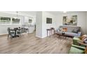 Inviting open-concept living room with modern decor, hardwood floors, and seamless flow to the kitchen at 2519 Miriam Ln, Decatur, GA 30032