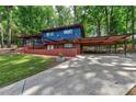 Modern home featuring a spacious carport and patio, perfect for outdoor living and entertaining at 3348 Lynnray Dr, Atlanta, GA 30340