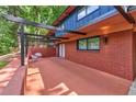Inviting patio with brick accents, covered pergola, and comfortable seating area at 3348 Lynnray Dr, Atlanta, GA 30340