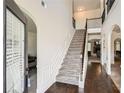Grand foyer showcases soaring ceilings, elegant staircase, hardwood floors, and an open floor plan at 349 Pennant Ln, Fairburn, GA 30213