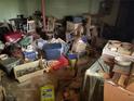 Storage area in basement full of clutter, furniture, and various items at 5804 S South Gordon Sw Rd, Austell, GA 30168