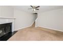 Bright living room with a fireplace and stairs to the next floor at 5228 Kirk Dr, Atlanta, GA 30349