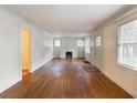 Spacious living room with hardwood floors, a fireplace, and ample natural light at 2129 Fairhaven Ne Cir, Atlanta, GA 30305