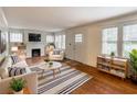 Bright living room with fireplace, hardwood floors and modern furniture at 2129 Fairhaven Ne Cir, Atlanta, GA 30305