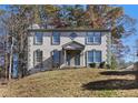 Attractive two-story home featuring a symmetrical facade and a well-maintained front lawn at 508 Sutters Mill Rd, Stone Mountain, GA 30087