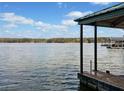 Picturesque lake view from the dock, showcasing calm waters and distant trees at 5500 Mccoy Nw Rd # 15, Acworth, GA 30101