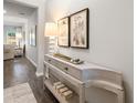 Neutral-toned entryway featuring decorative console table, stylish decor, and hardwood floors at 5633 Hislop Ln # 86, Mableton, GA 30126