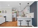 Well-appointed kitchen featuring stainless steel appliances, white cabinetry, and a breakfast bar at 2742 Oakland Ter, Decatur, GA 30032