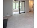 View of the carpeted living room with sunroom, door, and fireplace at 408 Smokerise Se Cir, Marietta, GA 30067