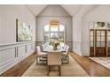 Bright dining room with hardwood floors, wainscotting and large windows providing lots of natural light at 1304 Marietta Country Club Nw Dr, Kennesaw, GA 30152