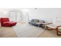 Bright living room with modern decor, light wood floors, and large windows at 3264 Henderson Mill Rd # C, Atlanta, GA 30341