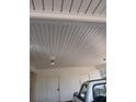 A well-lit carport with two access doors offering protected parking space for vehicles at 4985 Doby Ln, Austell, GA 30106