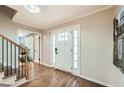 Inviting foyer with hardwood floors and a white front door framed by sidelights at 2772 Dunnington Cir, Atlanta, GA 30341