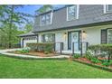 Welcoming home featuring a blue door, manicured landscaping, and well-maintained walkway leading to the entrance at 2772 Dunnington Cir, Atlanta, GA 30341