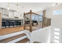 Open-concept living space with hardwood floors, a wooden stairway, and abundant natural light at 1105 Rivard Nw Cir, Atlanta, GA 30318