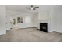 Open concept living room featuring new carpet, fireplace and an open concept design at 2864 Parkway Close, Lithonia, GA 30058
