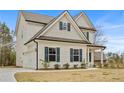 Attractive two-story home with a side-entry garage and professionally landscaped yard at 1408 Seals Rd, Dallas, GA 30157