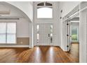 Bright entryway with hardwood floors and a large window above the front door at 2555 Stonevalley Ln, Cumming, GA 30041