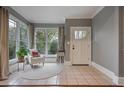 Cozy sunroom with tile floors, large windows, and natural light at 215 Terrace Ne Dr, Atlanta, GA 30305